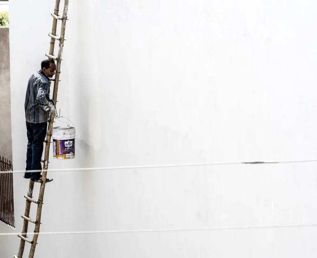 House painter in Multan painting a house exterior wall