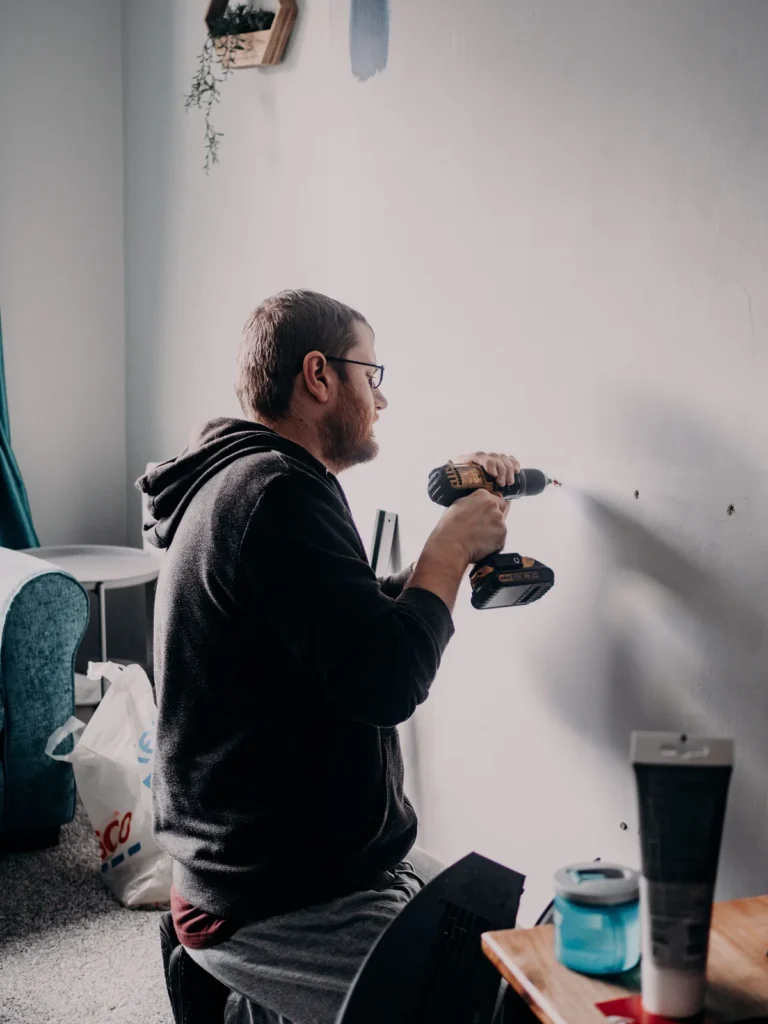 Handyman in Multan drilling a wall