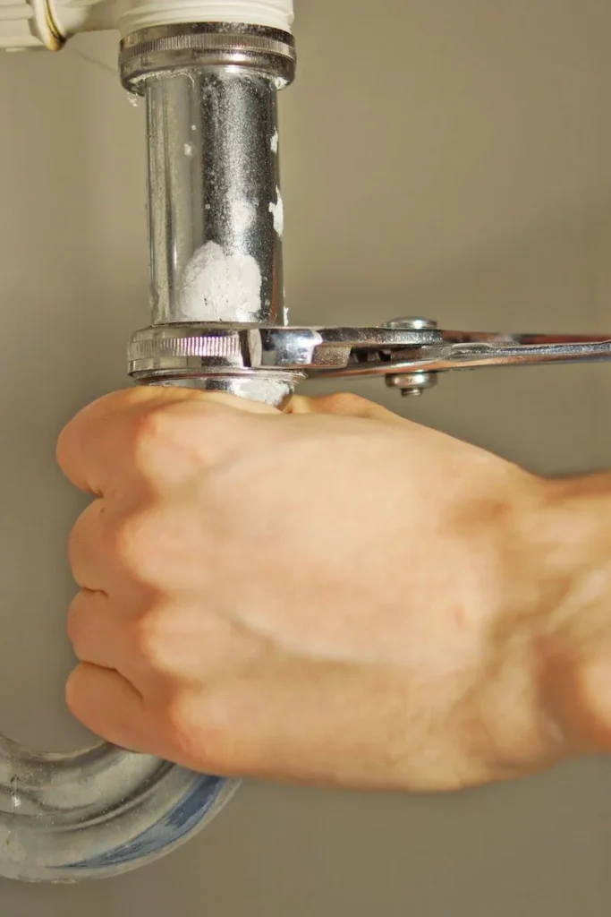 Plumber in Multan cleaning a blocked drain