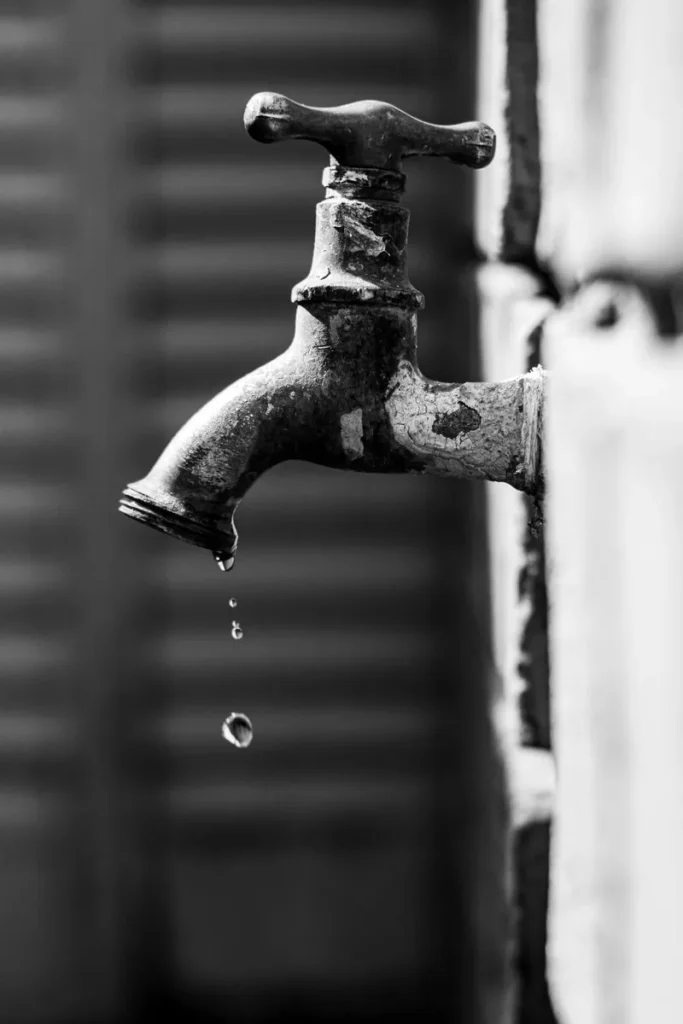 Plumbing Services Plumber in Multan repairing a tap