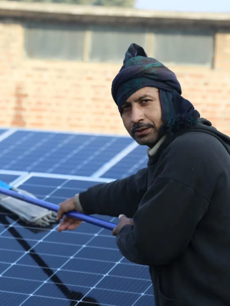 Solar Service Solar panel cleaning on a rooftop in Multan